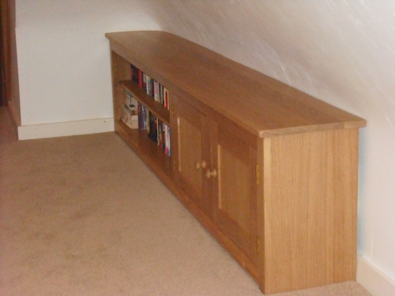 Wooden cabinet with cupboard and shelf sections
