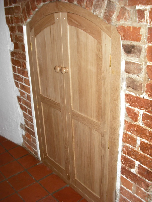 Built in wooden arched cupboard