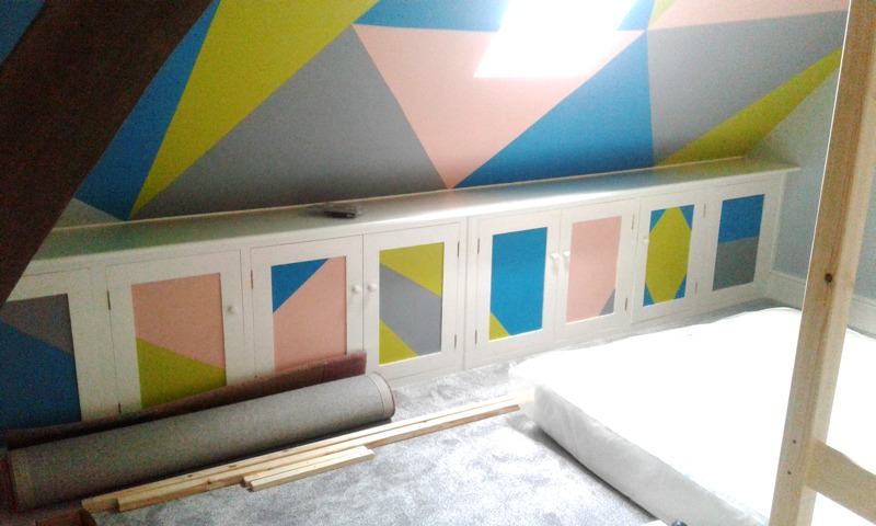built in low level storage with geometric coloured patterns