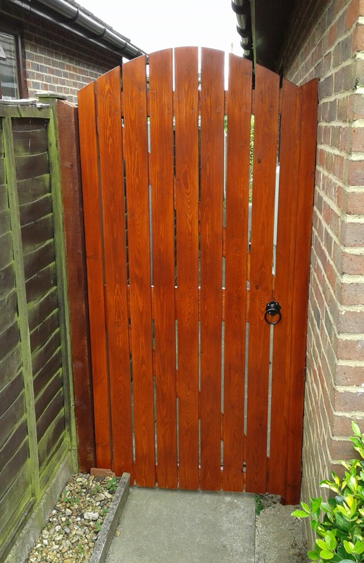 red wood stained side gate