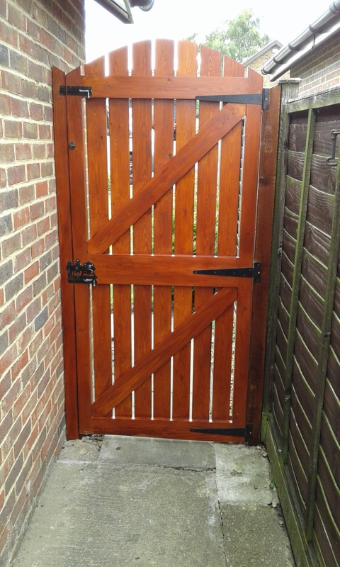 red wood stained side gate and fittings